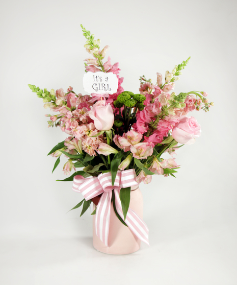 shades of pink and green in pink ceramic vase
